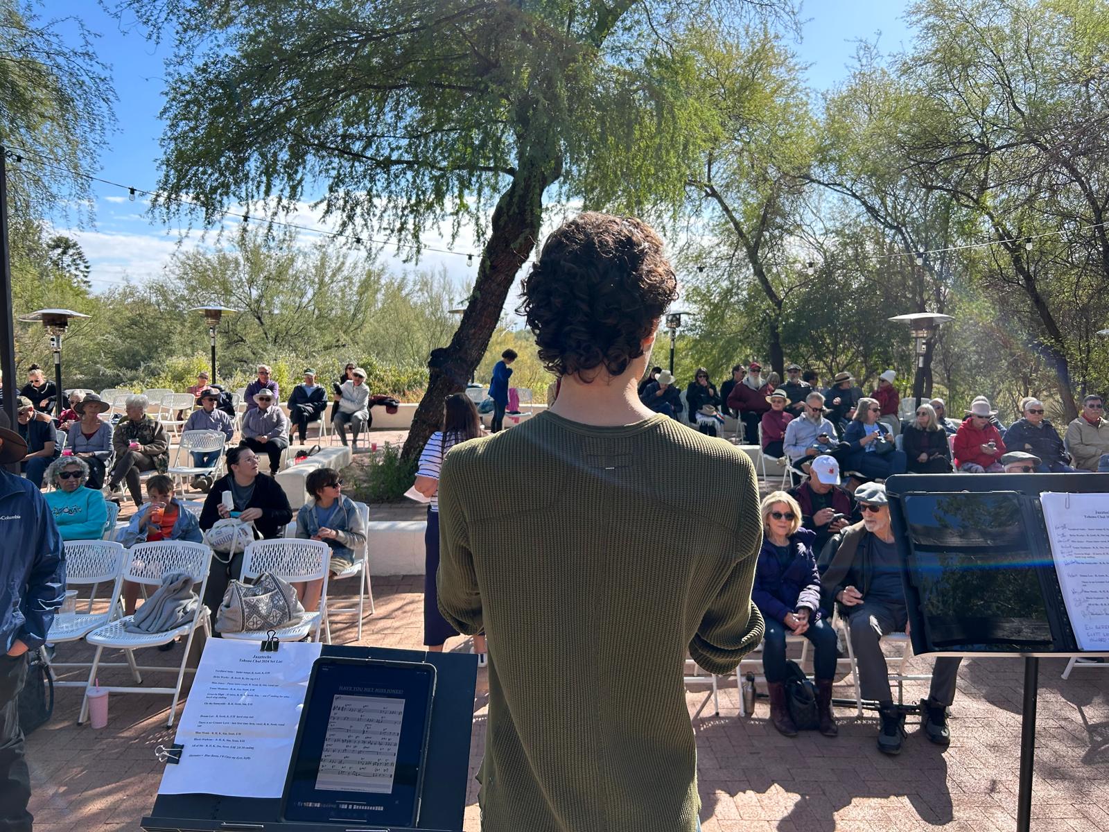 Dante speaking to concert audience.